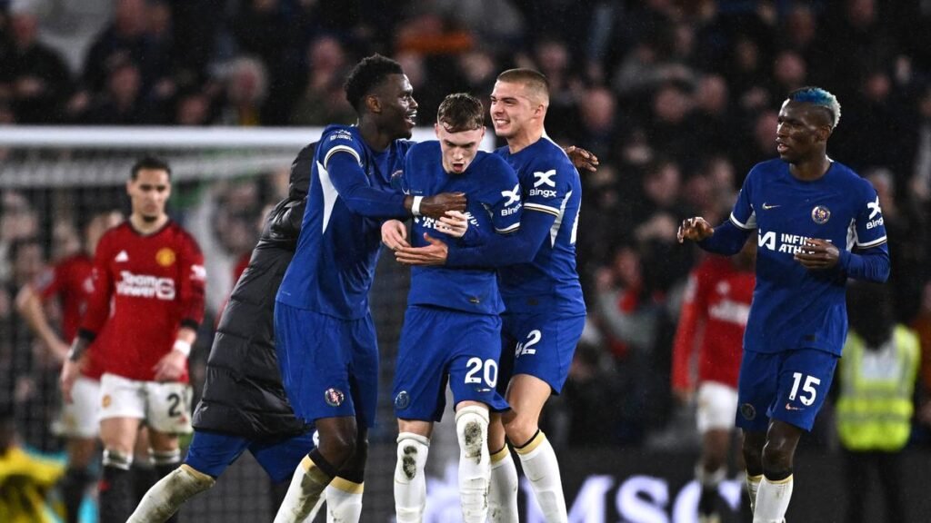 Chelsea’s Cole Palmer celebrates scoring their fourth goal against Manchester United with Benoit Badiashile and Alfie Gilchrist, on April 4, 2024 |